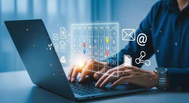 Man managing schedule and appointments with a calendar application on a laptop for time management photo