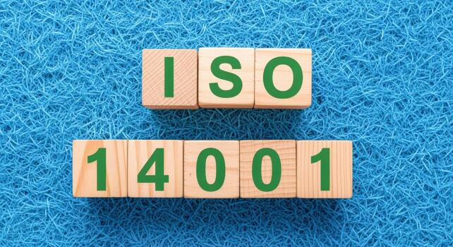 Environmental Management System ISO 14001 Standard Wooden Blocks on Blue Background, Demonstrating Compliance and Certification photo