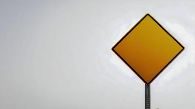 Blank Yellow Diamond Road Sign Against a Clear Sky, Ready for Custom Text and Graphics photo