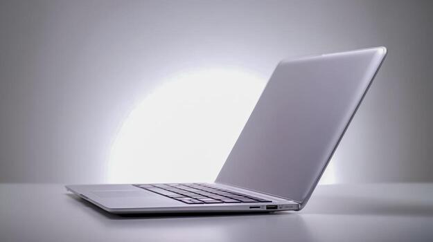 Sleek Modern Laptop Open on Clean White Desk for Business Technology and Productivity photo