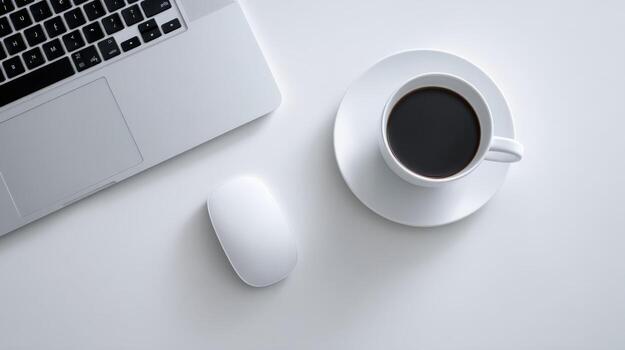 Minimalist Workspace Top-View of Laptop, Mouse, and Coffee Cup on Clean White Surface photo