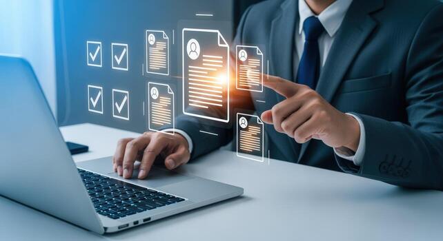 Professional reviews digital documents on laptop, confirming applications, selecting candidates, and completing tasks online photo