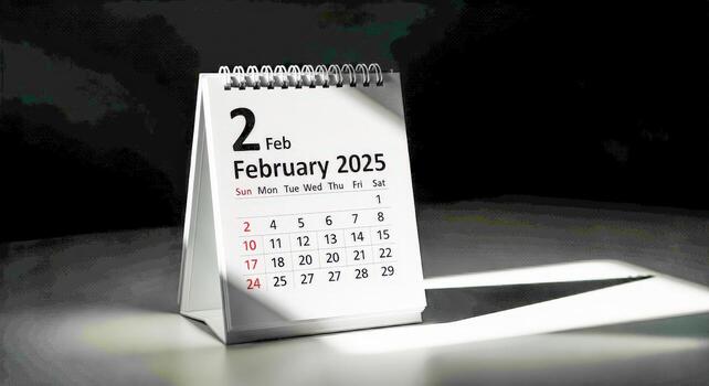 February 2nd, 2025 Calendar Page Standing on a Dark Surface Representing a Specific Date in the Future photo