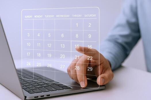 Virtual Calendar Meeting Schedule on Laptop Screen with Hand Touching Interface for Business Planning photo