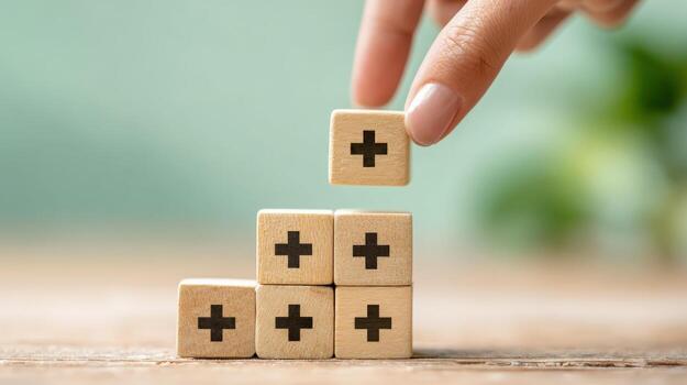Building Blocks of Positivity Hand Stacking Wooden Cubes with Plus Signs for Growth and Development photo