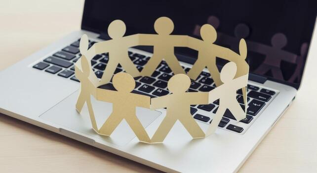 Paper People Chain on Laptop Collaboration, Teamwork, and Digital Connectivity in Business photo