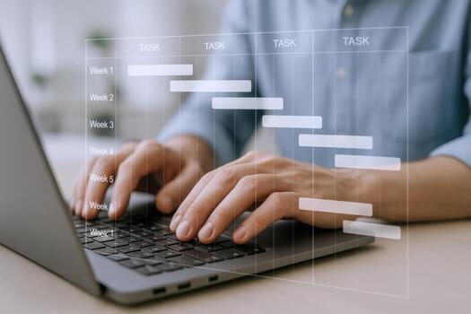 Project Management Software Displayed on Laptop with Male Hands Typing, Illustrating Workflow and Timeline photo