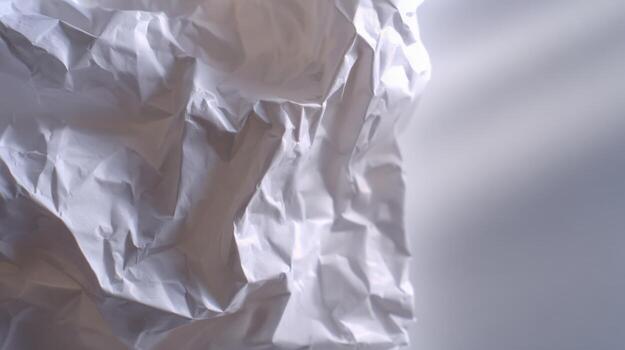 Abstract Crumpled White Paper Texture with Shadows for Graphic Design and Artistic Backgrounds photo