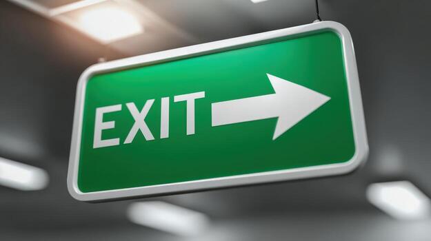 Green Emergency Exit Sign with Arrow in a Public Building for Safety and Evacuation photo