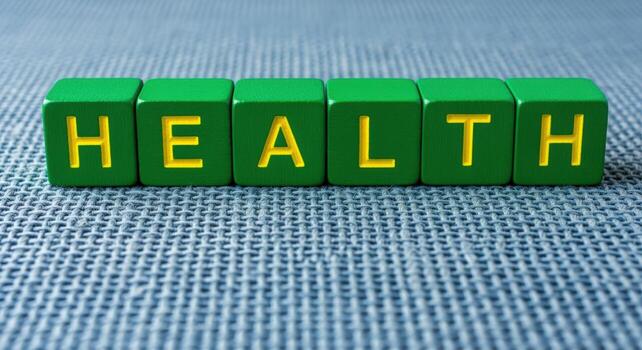 Green Wooden Blocks Spelling Health on a Textured Background Representing Wellness and Wellbeing photo