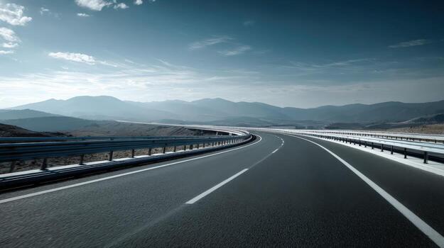 Scenic Highway View Leading to Distant Mountains, Open Road Journey on Asphalt Under Blue Skies photo