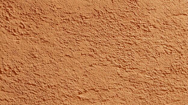 Textured Plaster Wall Background with Rough Surface in Warm Earthy Tone, Perfect for Architecture and Design photo