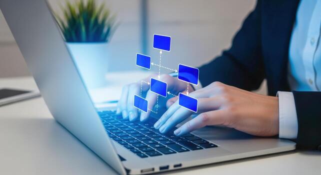 Businesswoman typing on laptop with organizational chart, visualizing company structure and management hierarchy in digital form photo
