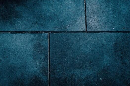 A dark blue wall with a square pattern photo