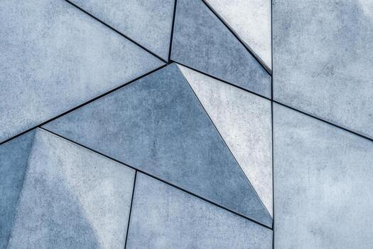 A blue wall with geometric shapes on it photo