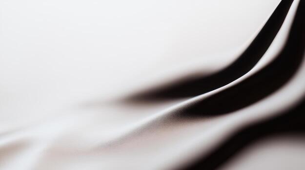 Texture of smooth fabric draped elegantly in soft lighting photo