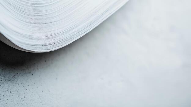 Open book resting on a textured surface with soft lighting photo