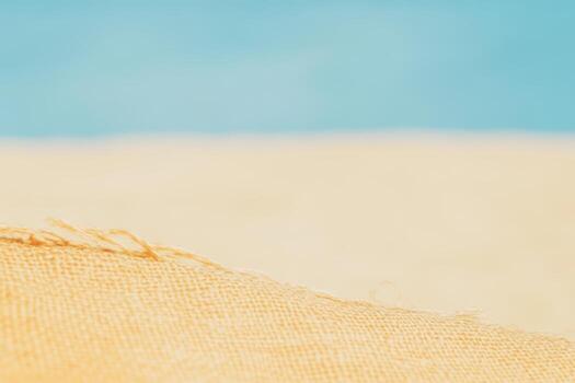 Soft sandy texture and clear blue sky at a beach on a sunny day photo