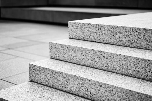 Steps made of grey stone forming a modern architectural design in a city photo
