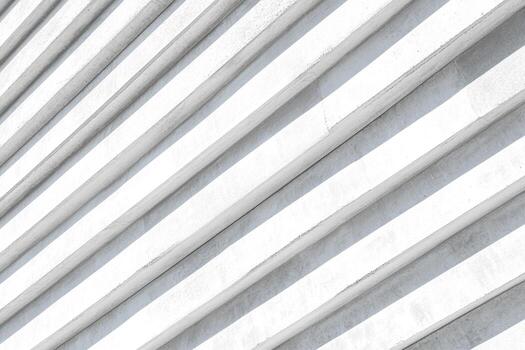 Modern architectural design featuring curved white lines in an urban setting photo