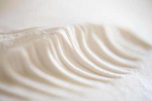 Delicate waves of flour arranged on a smooth surface in a bright kitchen photo