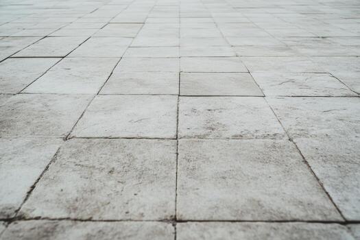 Surface of textured stone pavers arranged in a uniform pattern photo
