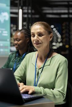 Woman consultant monitoring financial updates and targets on laptop, using data forecasting and economic analysis for goal setting and enterprise objectives. Project overview at night. photo