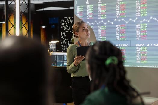 Business associates examining key performance indicators within the enterprise activity. Conducting evaluations and discuss updates to foster professional development, team efficiency. photo