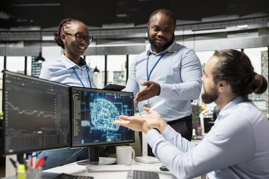 Teamworking stockbrokers leverage AI technology to optimize trading strategies. Hedge fund colleagues in office using deep learning software to enhance predictive accuracy of stock market movements photo