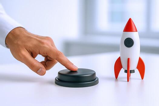 Business Launch Concept Hand Pressing Button Next to Rocket Model on Desk, Ready for Takeoff photo