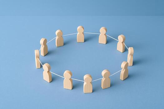 Teamwork Circle Wooden Figures Connected by String Symbolizing Collaboration, Unity, Communication, and Teamwork in Business photo