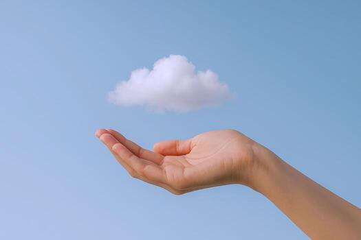 Conceptual Hand Holding Cloud Against Blue Sky Metaphor for Connectivity, Cloud Computing, and Dreams photo
