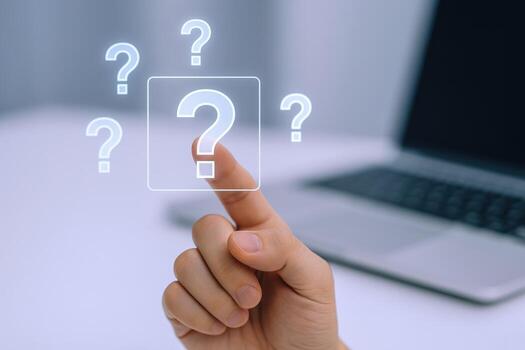 Interactive Digital Interface Featuring a Question Mark Pressed by a Hand with Laptop in Background photo