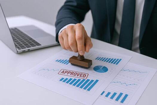 Approved Document with Businessman Hand Stamping Financial Graph Data, Showing Success and Business Verification photo