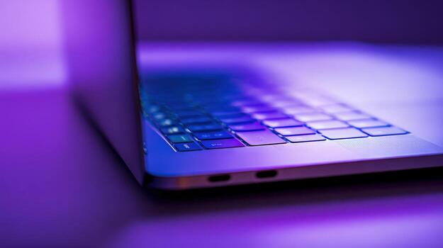 Laptop Keyboard Close-Up with Modern Design and Purple Lighting, Displaying Technology and Innovation photo