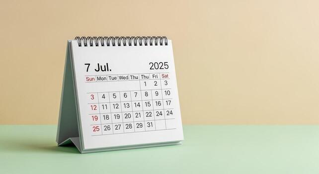 Desktop Calendar Showing July 7, 2025 on Beige Background, Planning and Organization Concept photo