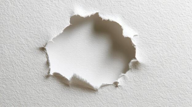 Torn White Paper Reveals a Bright Void, Highlighting Texture and Abstract Form photo