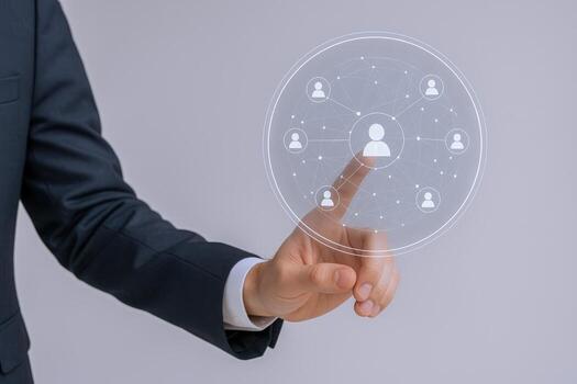 Man in suit touching digital network connecting people Concept of global business connections and communication photo