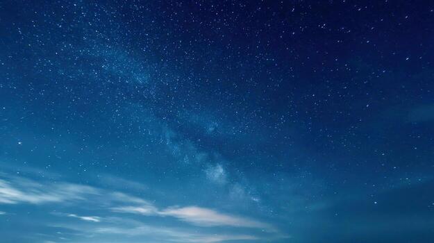 Magnificent Night Sky Displaying Countless Stars with Milky Way Galaxy Over Clouds photo