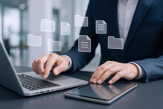 Business Professional Managing Digital Documents and Folders on Laptop and Tablet for Efficient Workflow photo