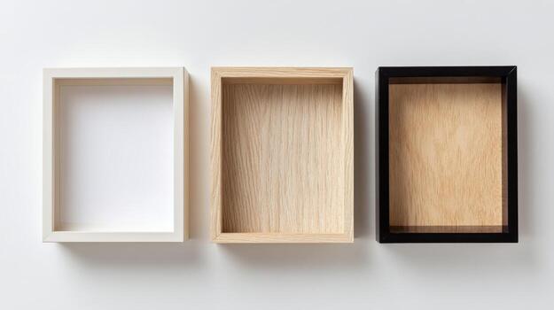Three Empty Wooden Shadow Boxes White, Natural, and Black Frames on a White Background photo