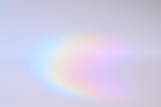 Subtle Rainbow Refraction on White Surface for Backgrounds, Textures, and Creative Overlays in Photography and Design photo