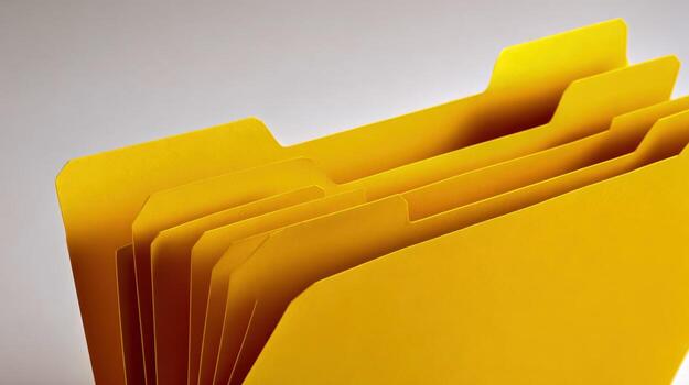 Organized Yellow File Folders Essential Office Supplies for Efficient Document Management and Archiving photo