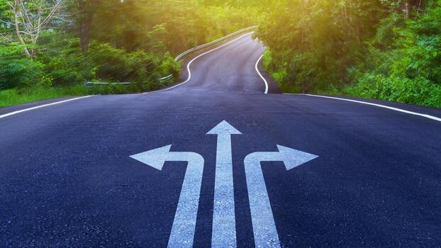 Arrows on asphalt road ground with three direction arrow choices, left, right or move forward on Curve of the road, difficult decision making concept, Motivation and growth. photo