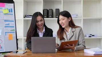 business team analysts talking, working together, discussing data management using laptop computer video