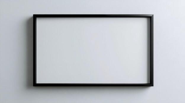 A black square frame on a wall with a white background photo