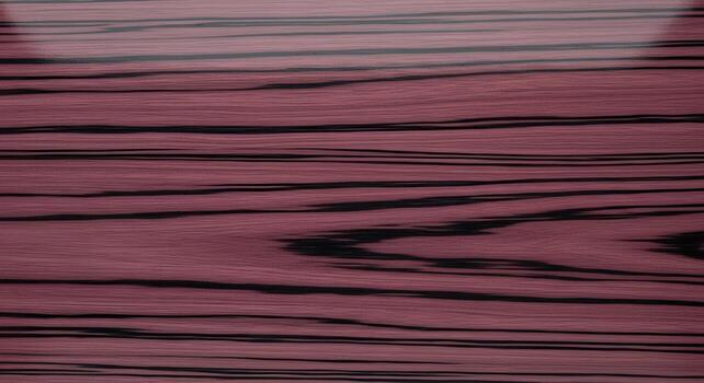 Detailed Macro Photography of a Wood Grain Pattern with Red and Black Color Tones photo