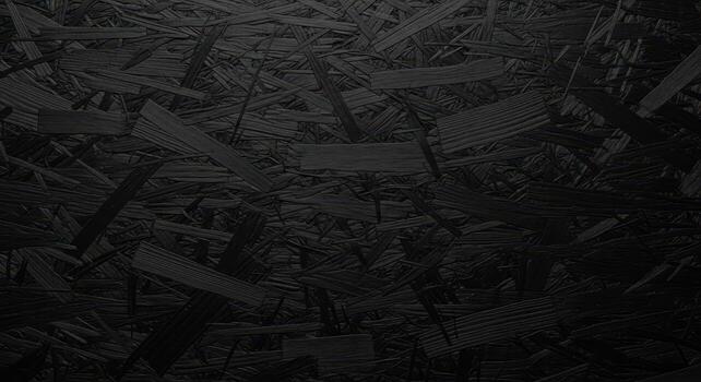 Dark abstract textured background featuring a complex, overlapping pattern of deep black wood shards, creating a mysterious and rugged surface for design and artistic projects photo