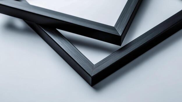 Close-up of Two Black Picture Frames Angled on White Surface for Mockups and Product Display photo