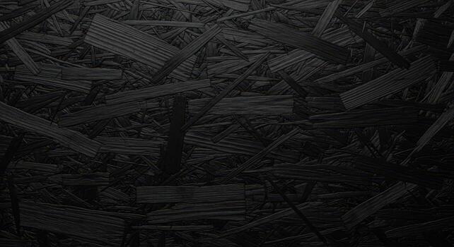 Dark Abstract Textured Background Composed of Various Sized Wood Shavings and Fragments photo